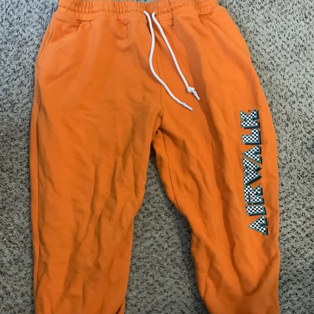 Bright orange sweatpants